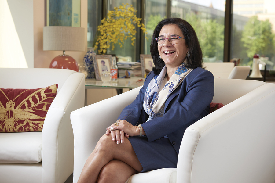 Maria A. Oquendo, MD, PhD sitting in a chair
